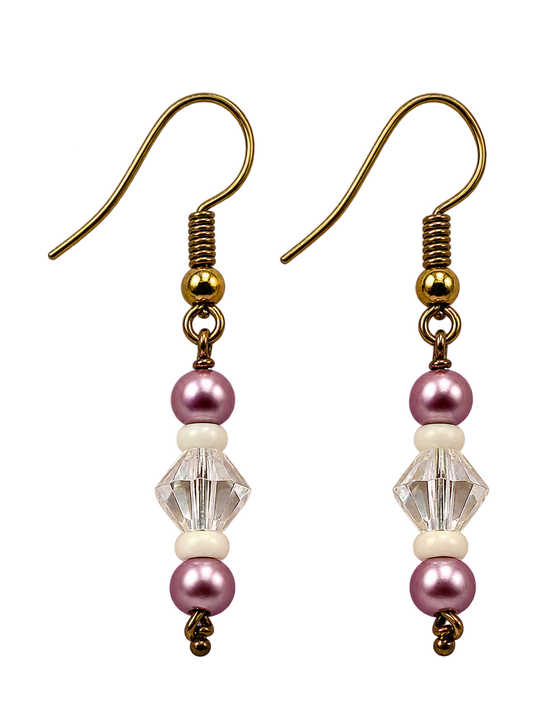 A pair of drop earrings with antique gold fishhook wires, a small gold bead, a clear faceted bead, and pink pearl-like beads on a white background.