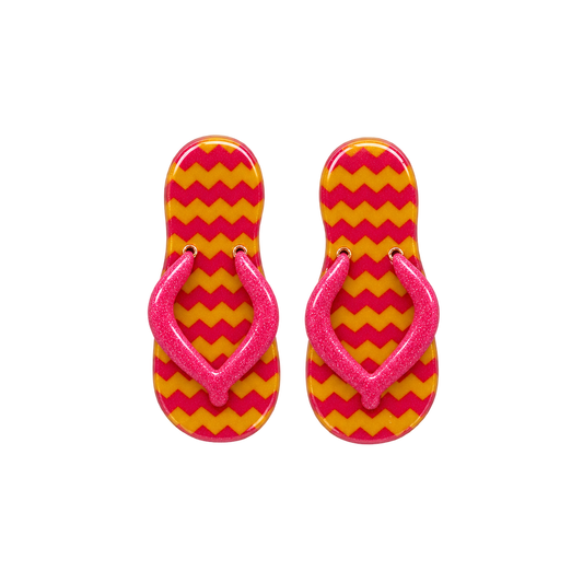 A pair of flip-flop sandals with a bright pink glittery strap and a yellow and pink chevron patterned sole.